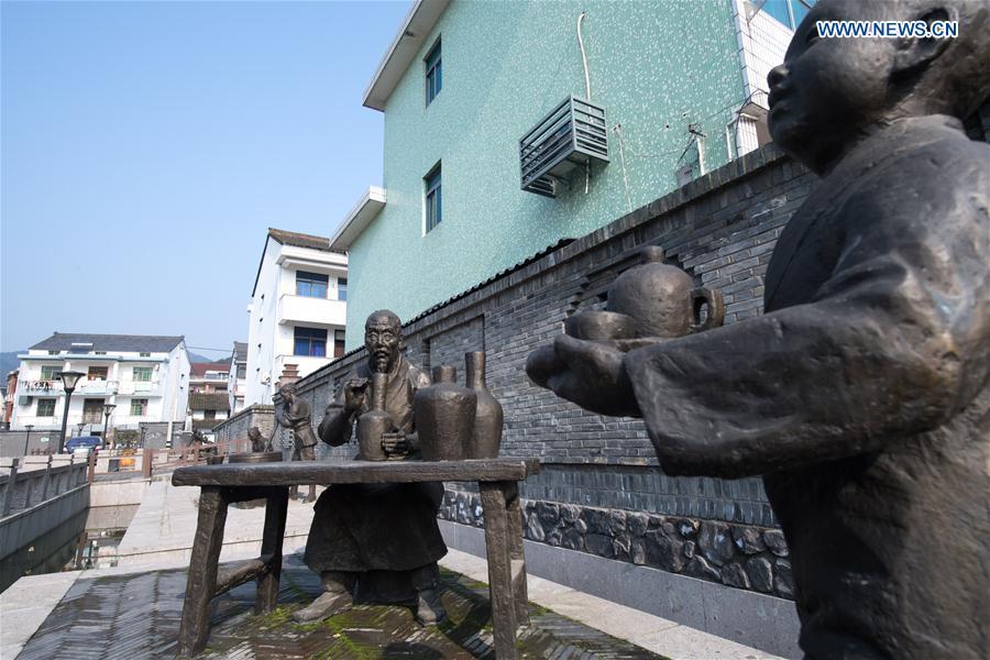 Statues depicting celadon craftsmen are seen at Dashan Xiaowu Village in Shangyu District of Shaoxing, east China\'s Zhejiang Province, Jan. 22, 2019. As the birthplace of celadon, Shangyu District is giving full support to revive the local celadon culture, protecting ancient relics, promoting celadon artists and boosting tourism. (Xinhua/Weng Xinyang)