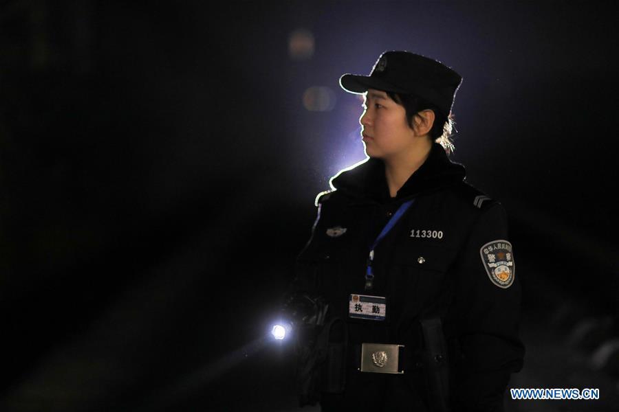 A policewoman patrols the high-speed railway in Rongjiang County, southwest China\'s Guizhou Province, Jan. 22, 2019. Rongjiang Railway Police Station conducts two or three safety inspections at night every week during the Spring Festival travel rush. (Xinhua/Ou Dongqu)