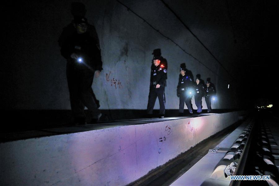 Policemen patrol the high-speed railway in Rongjiang County, southwest China\'s Guizhou Province, Jan. 22, 2019. Rongjiang Railway Police Station conducts two or three safety inspections at night every week during the Spring Festival travel rush. (Xinhua/Ou Dongqu)