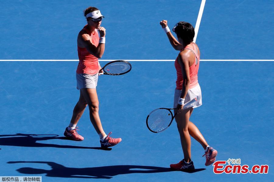 Zhang Shuai of China and Samantha Stosur of Australia celebrate after winning the women\'s doubles final match against Timea Babos of Hungary and Kristina Mladenovic of France at 2019 Australian Open in Melbourne, Australia, Jan. 25, 2019. (Photo/Agencies)