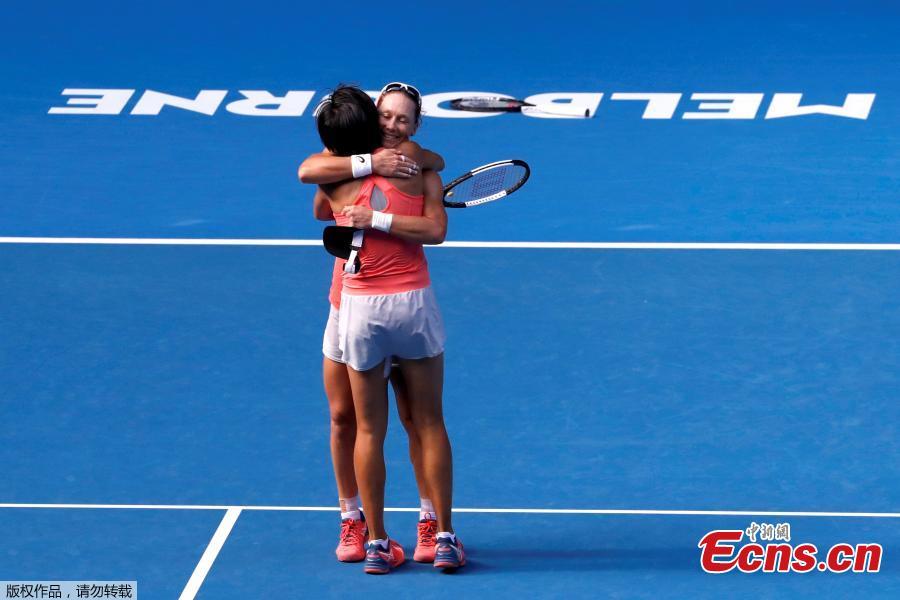 Zhang Shuai of China and Samantha Stosur of Australia celebrate after winning the women\'s doubles final match against Timea Babos of Hungary and Kristina Mladenovic of France at 2019 Australian Open in Melbourne, Australia, Jan. 25, 2019. (Photo/Agencies)