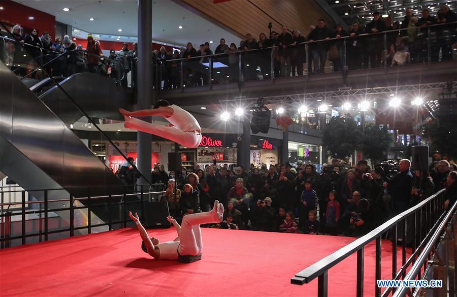Acrobats perform in a shopping mall at Potsdamer Platz in Berlin, capital of Germany, on Jan. 24, 2019. \