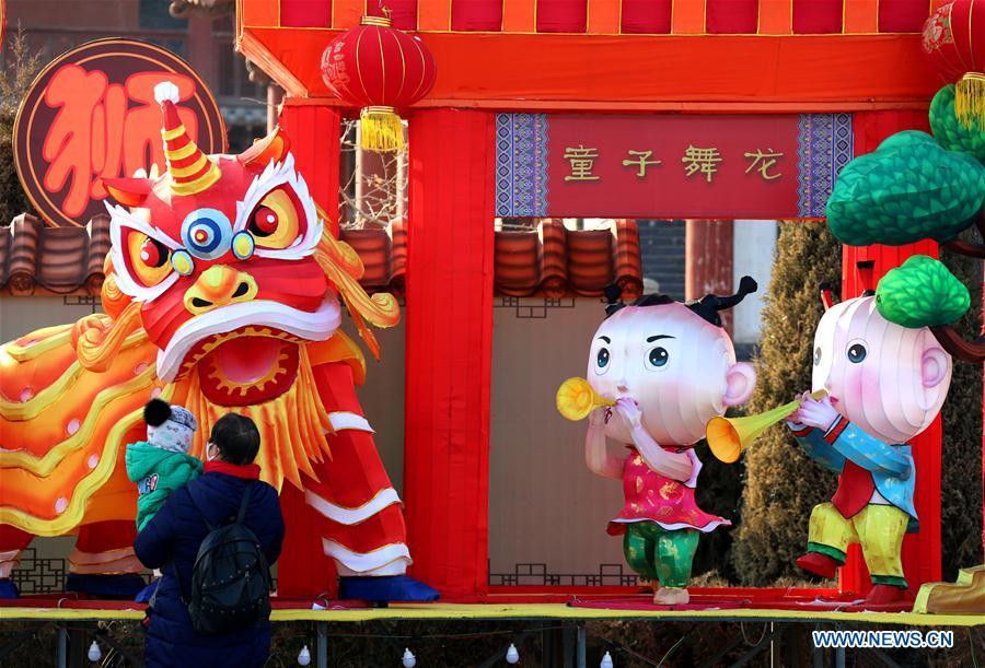 People visit a lantern fair in Zhangye City, northwest China\'s Gansu Province, Jan. 23, 2019. Festive decorations are set up across China to greet the lunar New Year, or Spring Festival, which starts from Feb. 5 this year. (Xinhua/Zhang Yuan)