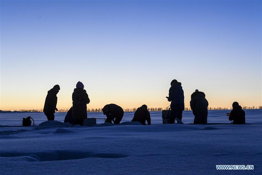 Researchers collect data of snow cover in Sa\'erwuzike Village in Kaxajar township of Zhaosu County, northwest China\'s Xinjiang Uygur Autonomous Region, Jan. 18, 2019. A nine-member research team with an average age under 30 from the Xinjiang Institute of Ecology and Geography under the Chinese Academy of Sciences started a research on snow cover on the Tianshan Mountains in Xinjiang. Snow cover on the Tianshan Mountains is an important source of water resources. Snowmelt provides an abundant water supply for river flow in this area and also affects the ecological system of agricultural and animal husbandry production in the downstream oasis. (Xinhua/Hu Huhu)