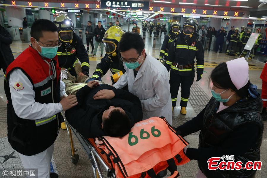 Medical workers participate in a firefighting drill at Beijing West Railway Station on Jan 24, 2019.