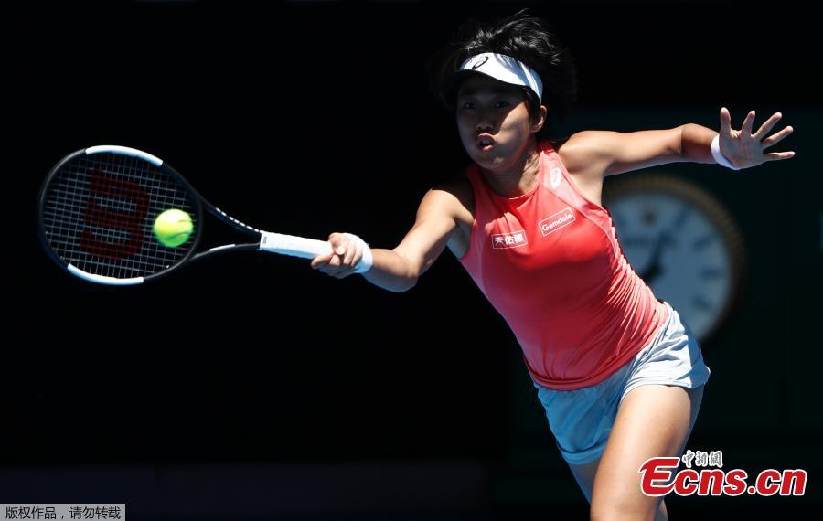 Zhang Shuai of China hits a return during the women\'s doubles final match against Timea Babos of Hungary and Kristina Mladenovic of France at 2019 Australian Open in Melbourne, Australia, Jan. 25, 2019. (Photo/Agencies)