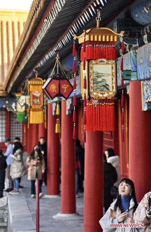 Tourists view the traditional lanterns in the Palace Museum, also known as the Forbidden City, in Beijing, capital of China, Jan. 25, 2019. The Palace Museum is decorated to celebrate the upcoming Spring Festival, or the Chinese Lunar New Year, which falls on Feb. 5 this year. (Xinhua/Li Xin)