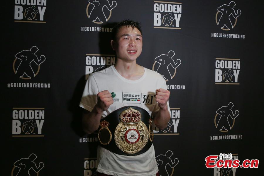 Chinese boxer Xu Can, 24, poses for photo after winning the World Boxing Association (WBA) featherweight title in Houston, the U.S., Jan. 26, 2019. (Photo: China News Service/Zeng Jingning)