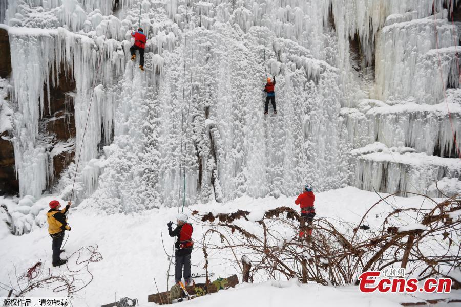 A man climbs up an artificial ice wall located in a courtyard in the city of Liberec, Czech Republic, Sunday, Jan. 27, 2019.(Photo/Agencies)