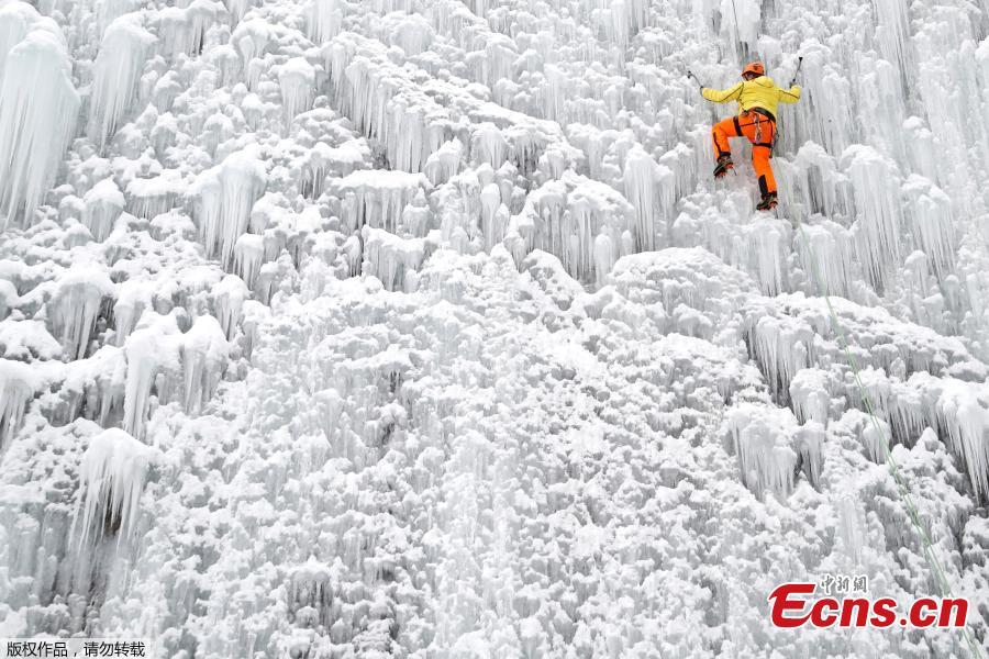 A man climbs up an artificial ice wall located in a courtyard in the city of Liberec, Czech Republic, Sunday, Jan. 27, 2019. (Photo/Agencies)