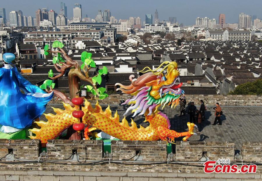 Colored dragon lanterns are installed on the Ming Dynasty (1368-1644) city wall ahead of the Spring Festival, China\'s Lunar New Year, in Nanjing City, Jiangsu Province, Jan. 27, 2019. (Photo: China News Service/Yang Bo)