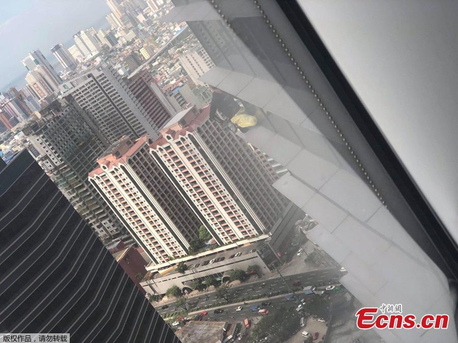 French urban climber Alain Robert stages his first climb in the Philippines as he scales a 43-floor skyscraper in Makati City, Manila, the Philippines, Jan. 29, 2019. (Photo/Agencies)