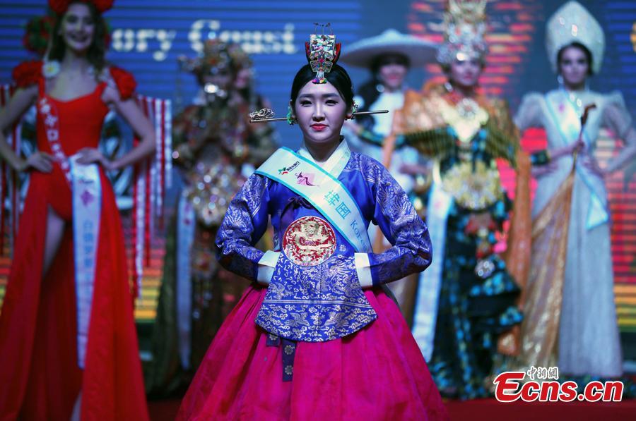 A participant competes in the world final of the 53rd Miss All Nations in Nanjing City, Jiangsu Province, Jan. 29, 2019. The pageant with the theme of eco-tourism included components of evening dress, bikini and national costumes. Participants from Russia, Mexico and Vietnam won the top three places. (Photo: China News Service/Yang Bo)