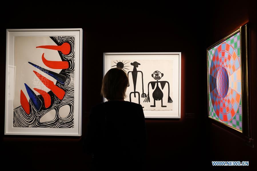 A visitor views the exhibits from Omer Tiroche gallery during the 64th edition of Brafa Art Fair at the Tour & Taxis in Brussels, Belgium, Jan. 28, 2019. A total of 133 Belgian and international galleries presented tens of thousands of art pieces at the fair, which will last till Feb. 3, 2019. Created in 1956, the Brafa Art Fair is one of the world\'s oldest and most prestigious art fairs. (Xinhua/Zheng Huansong)
