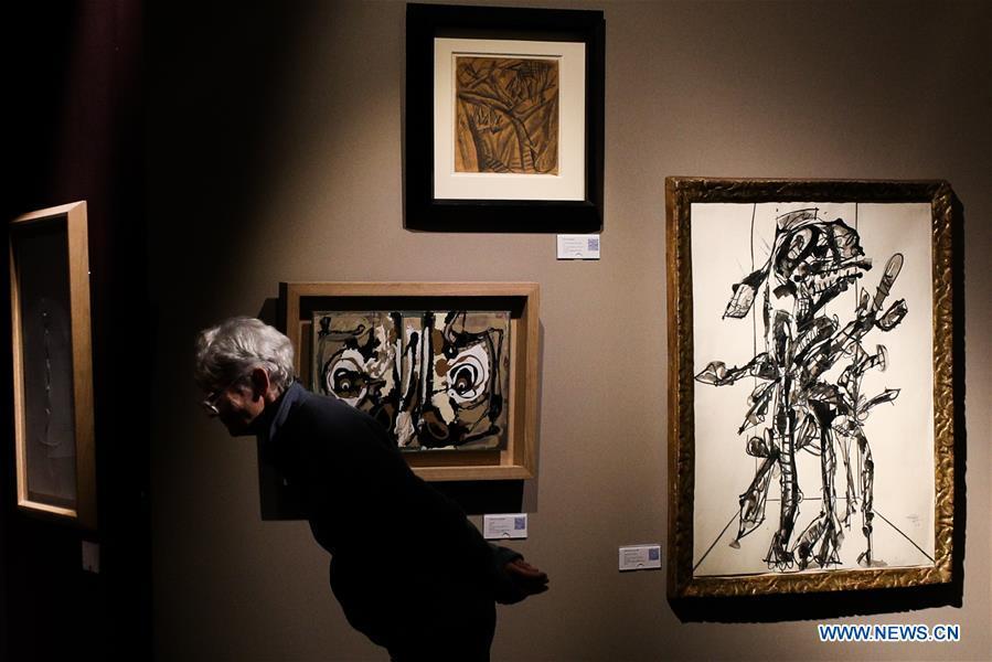 A visitor views exhibits from Simon Studer Art during the 64th edition of Brafa Art Fair at the Tour & Taxis in Brussels, Belgium, Jan. 28, 2019. A total of 133 Belgian and international galleries presented tens of thousands of art pieces at the fair, which will last till Feb. 3, 2019. Created in 1956, the Brafa Art Fair is one of the world\'s oldest and most prestigious art fairs. (Xinhua/Zheng Huansong)