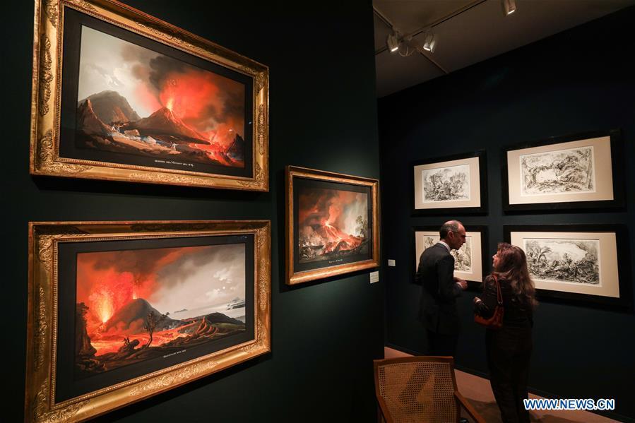 People talk at the stand of Grand-Rue Marie-Laure Rondeau Gallery during the 64th edition of Brafa Art Fair at the Tour & Taxis in Brussels, Belgium, Jan. 28, 2019. A total of 133 Belgian and international galleries presented tens of thousands of art pieces at the fair, which will last till Feb. 3, 2019. Created in 1956, the Brafa Art Fair is one of the world\'s oldest and most prestigious art fairs. (Xinhua/Zheng Huansong)