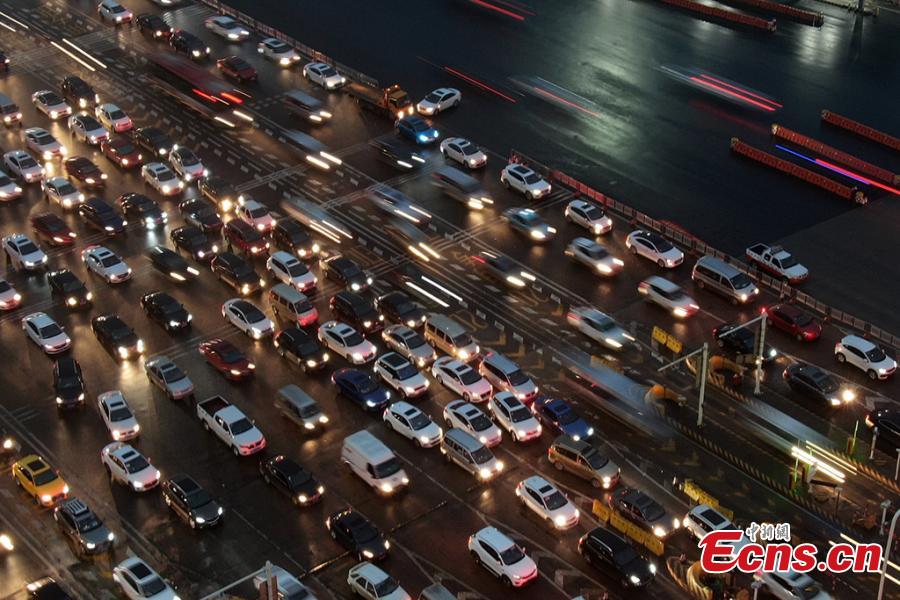 A drone photo shows heavy traffic on an expressway in Nanjing City, East China’s Jiangsu Province, Jan. 30, 2019. China is in the midst of its Spring Festival travel rush as millions of people go home for family reunions for the most important festival of the year. (Photo: China News Service/Yang Bo)