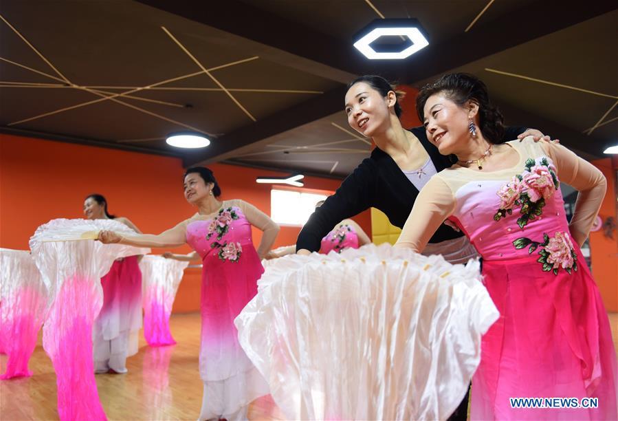 A dance instructor (2nd R) and trainees practice dancing at a cultural center in Nanhe County, north China\'s Hebei Province, Jan. 30, 2019. More than 2000 people have participated in art training programs at a cultural center in Nanhe County as a way to enrich their life. (Xinhua/Zhu Xudong)