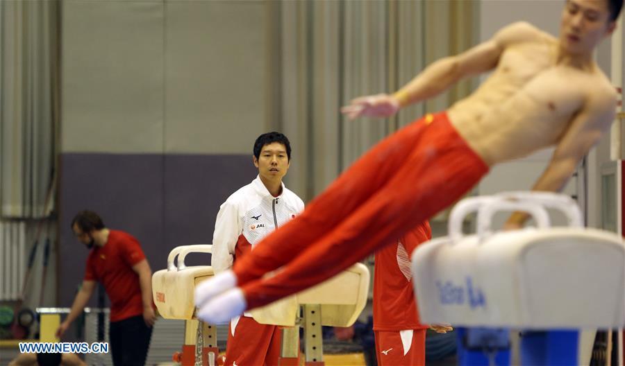 Mizutori Hisashi (C), head coach of Japanese men\'s gymnastics team, watches the training in Beijing, capital of China, Jan. 30, 2019. First-ever China-Japan gymnastics co-training camp started here on Jan. 27. (Xinhua/Luo Yuan)