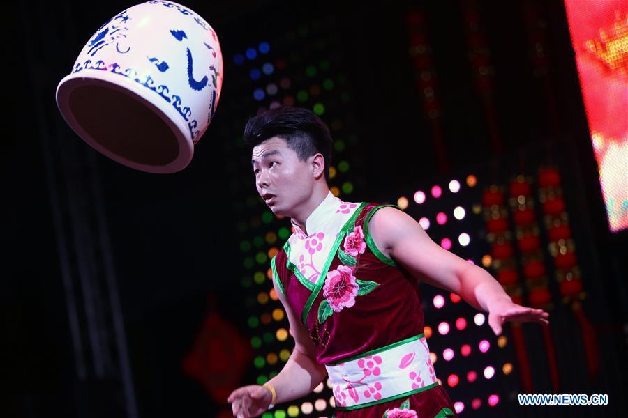An artist from north China\'s Shanxi Province performs acrobatics at a temple fair celebrating the Chinese Spring Festival in Sharm el-Sheikh, Egypt, Jan. 30, 2019. The Egyptian tourism city of Sharm el-Sheikh embraced a large festivity where hundreds of rejoiced Egyptians and Chinese celebrated the Chinese Spring Festival together. The event hosted by the Chinese Embassy in Egypt kicked off Wednesday and will run through Friday. (Xinhua/Ahmed Gomaa)