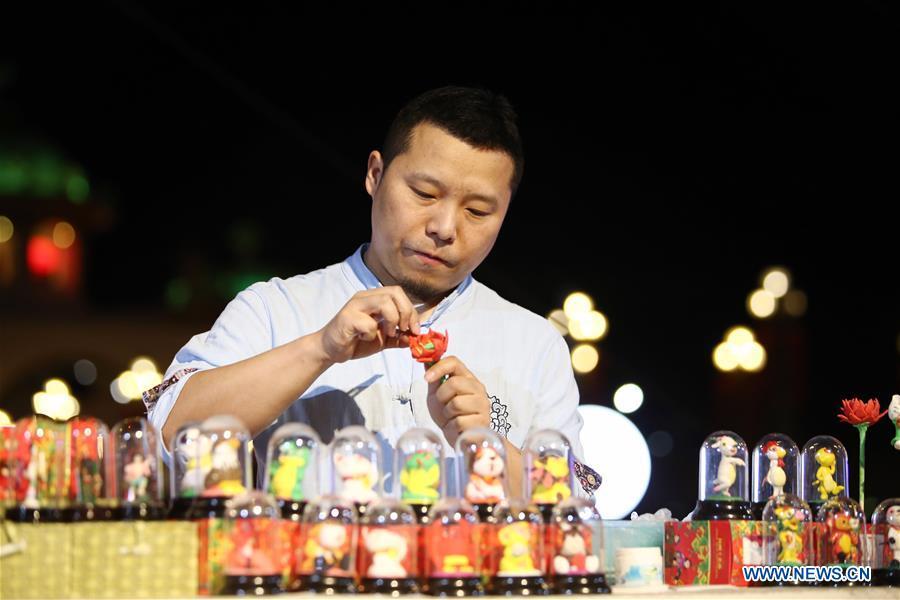 An artist from north China\'s Shanxi Province displays skills in making dough figurines at a temple fair celebrating the Chinese Spring Festival in Sharm el-Sheikh, Egypt, Jan. 30, 2019. The Egyptian tourism city of Sharm el-Sheikh embraced a large festivity where hundreds of rejoiced Egyptians and Chinese celebrated the Chinese Spring Festival together. The event hosted by the Chinese Embassy in Egypt kicked off Wednesday and will run through Friday. (Xinhua/Ahmed Gomaa)