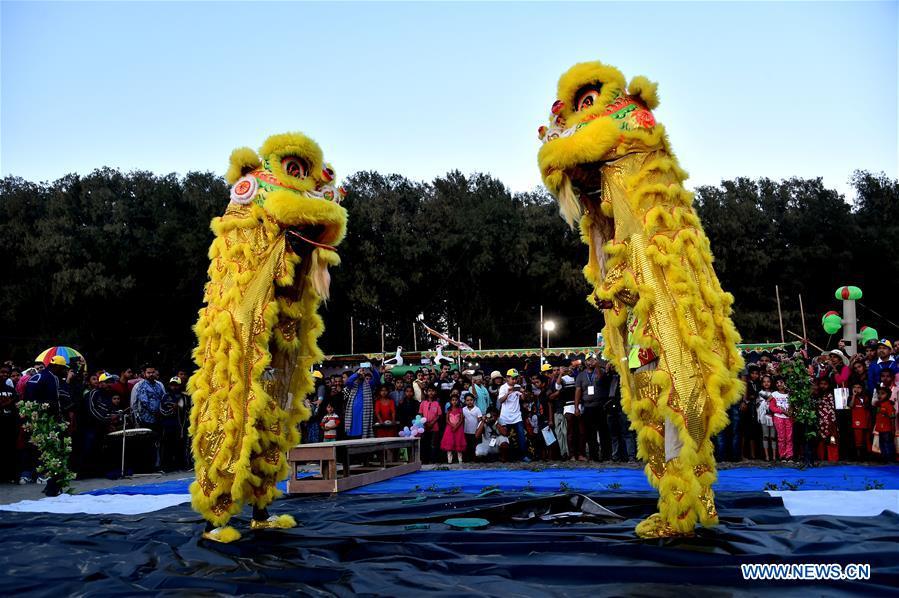 People view a lion dance performance during a two-day kite festival kicked off in Cox\'s Bazar in southeastern Bangladesh on Feb. 1, 2019. (Xinhua/Stringer)