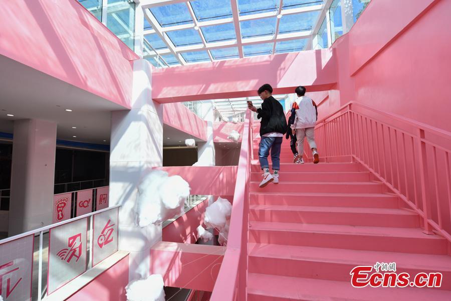 Passengers walk on pink stairs at the exit of Chunrong Street Subway Station in Kunming City, Southwest China’s Yunnan Province. With cotton clouds suspended in the air and cute love quotes written on the stairs, the pink subway station has quickly gained widespread traction among young people. (Photo: China News Service/Ren Dong)