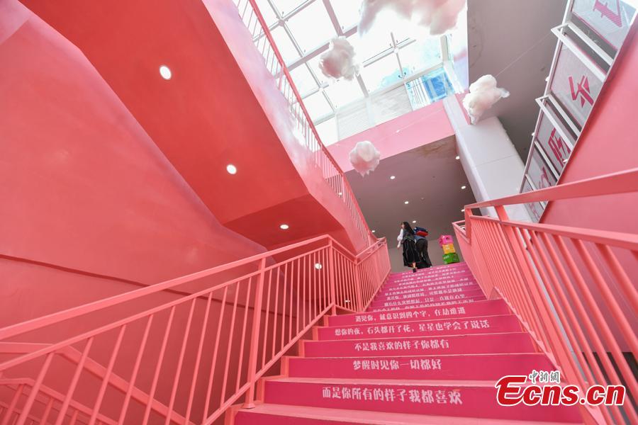 Passengers walk on pink stairs at the exit of Chunrong Street Subway Station in Kunming City, Southwest China’s Yunnan Province. With cotton clouds suspended in the air and cute love quotes written on the stairs, the pink subway station has quickly gained widespread traction among young people. (Photo: China News Service/Ren Dong)