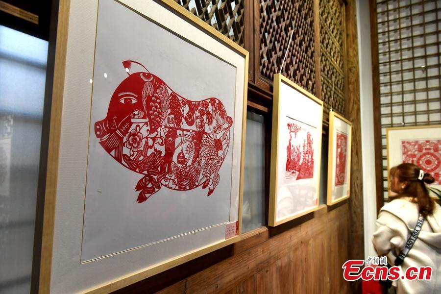 Pig-themed paper-cutting artworks are on display to  celebrate the upcoming Chinese New Year in Fuzhou, Fujian Province, Feb. 1, 2019. The Chinese New Year, or Spring Festival, falls on Feb. 5 this year. The Chinese paper-cutting has a history of more than 1,500 years. It was listed in the UNESCO Intangible Cultural Heritage Lists in 2009. (Photo/China News Service/Lyv Ming)
