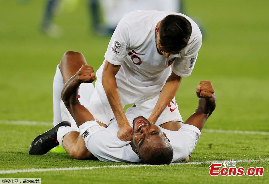 Soccer Football - AFC Asian Cup - Final - Japan v Qatar - - Qatar\'s Hasan Al Haydos and team mates celebrate winning the Asian Cup at the Zayed Sports City Stadium, Abu Dhabi, United Arab Emirates, February 1, 2019. Qatar stunned four-time champion Japan 3-1 to win the AFC Asian Cup for the first time as striker Almoez Ali scored his record-breaking ninth goal in the tournament on Friday. (Photo/Agencies)