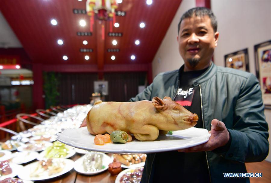 Sun Zhaoyong displays his carved Shoushan stone artwork \
