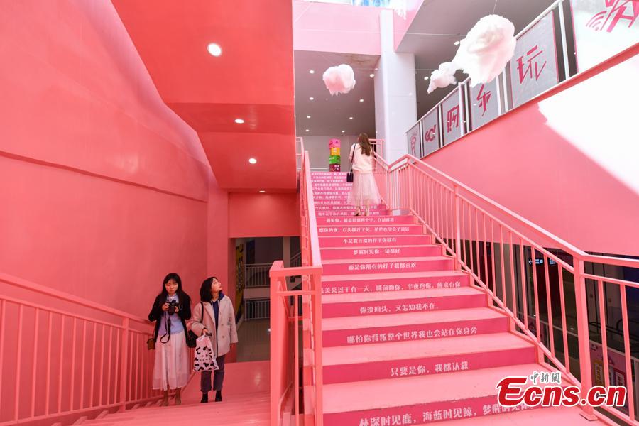 Passengers walk on pink stairs at the exit of Chunrong Street Subway Station in Kunming City, Southwest China’s Yunnan Province. With cotton clouds suspended in the air and cute love quotes written on the stairs, the pink subway station has quickly gained widespread traction among young people. (Photo: China News Service/Ren Dong)