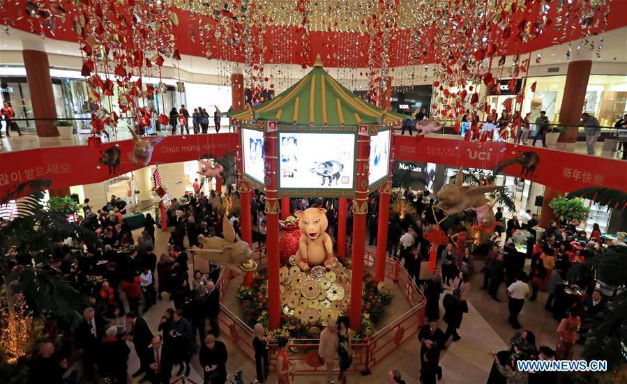 People attend a Chinese Lunar New Year celebration at South Coast Plaza in Costa Mesa, California, the United States, on Jan. 31, 2019. South Coast Plaza held a variety of activities such as dragon dance, lion dance, singing and dancing shows to celebrate the upcoming Chinese Lunar New Year. (Xinhua/Li Ying)