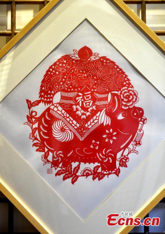 A pig-themed paper-cutting artwork is on display to  celebrate the upcoming Chinese New Year in Fuzhou, Fujian Province, Feb. 1, 2019. The Chinese New Year, or Spring Festival, falls on Feb. 5 this year. The Chinese paper-cutting has a history of more than 1,500 years. It was listed in the UNESCO Intangible Cultural Heritage Lists in 2009. (Photo/China News Service/Lyv Ming)
