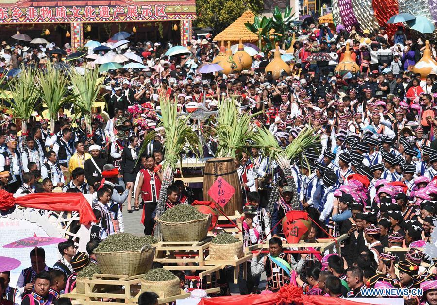 People attend Spring Festival celebration activities at a square in Lancang Lahu Autonomous County in Pu\'er City, southwest China\'s Yunnan Province, Feb. 7, 2018. People of ethnic groups wearing their traditional festive costumes took part in a parade to celebrate the Chinese Lunar New Year in Lancang Lahu Autonomous County. (Xinhua/Yang Zongyou)