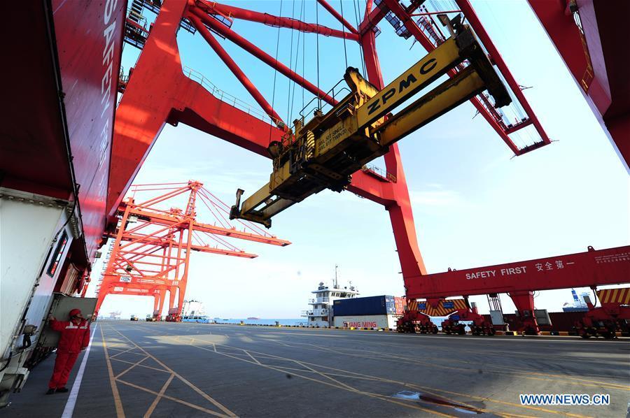 Gong Fuqiang, a crane driver, conducts security check for container loading at Zhenghe Xinggang Terminals of Taicang Port in Suzhou, east China\'s Jiangsu Province, Feb. 11, 2019, the first workday after Spring Festival holiday. (Xinhua/Ji Haixin)
