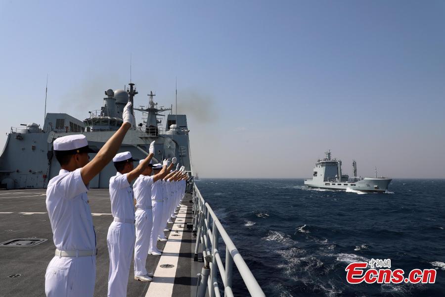 Soldiers on the PLA Navy ship Kunlun wave during the multinational military drill Peace-19 held in the waters off Karachi, Pakistan from Feb. 11 to 12. The drill undertook 23 programs including ship supply and maneuvers against a pirate attack (Photo: China News Service/Xue Chengqiang)