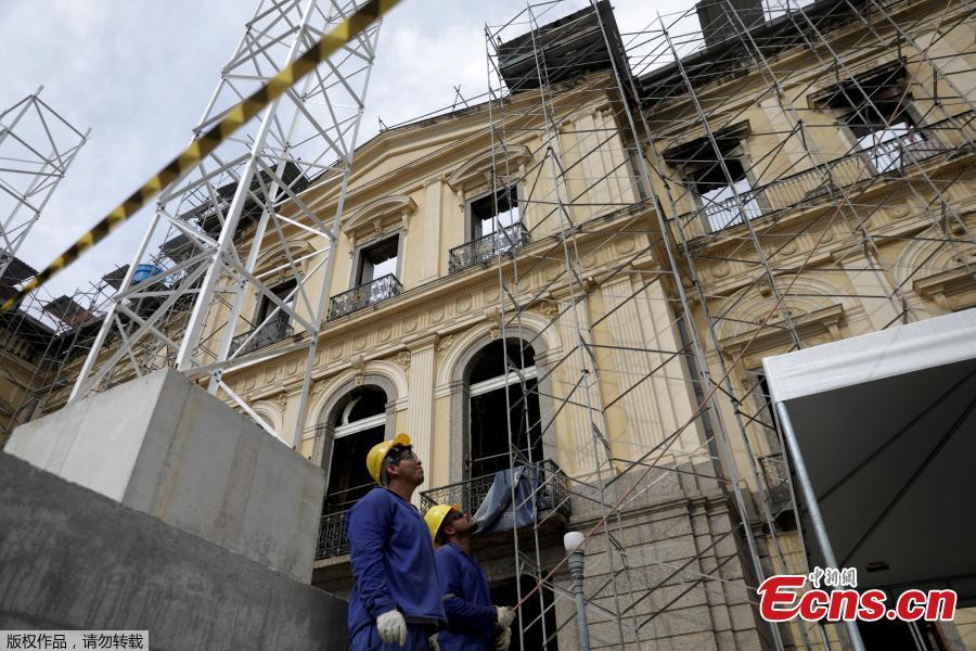Men work on the restoration of Brazil National Museum after its devastating fire, in Rio de Janeiro, Brazil, Feb. 12, 2019. Five months after fire gutted Brazil\'s 200-year-old National Museum, the site that once held some of the nation\'s greatest treasures remains a ruin of scorched walls, twisted metal and piles of ash. (Photo/Agencies)