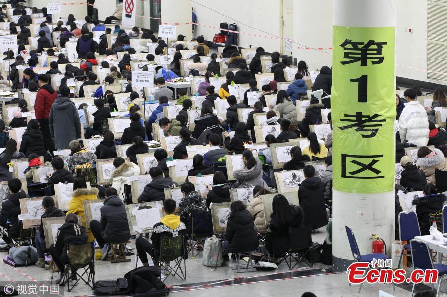 Students sit the entrance exam for Shandong University of Art & Design in Jinan City, East China\'s Shandong Province, Feb. 13, 2019. More than 6,500 students took the test, which applied face recognition and fingerprint checks to prevent fraud. (Photo/VCG)