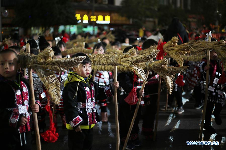 Children prepare to perform dragon dance to celebrate the upcoming Lantern Festival, which falls on Feb. 19 this year, in Shibing County, southwest China\'s Guizhou Province, Feb. 13, 2019. (Xinhua/Fang Peng)