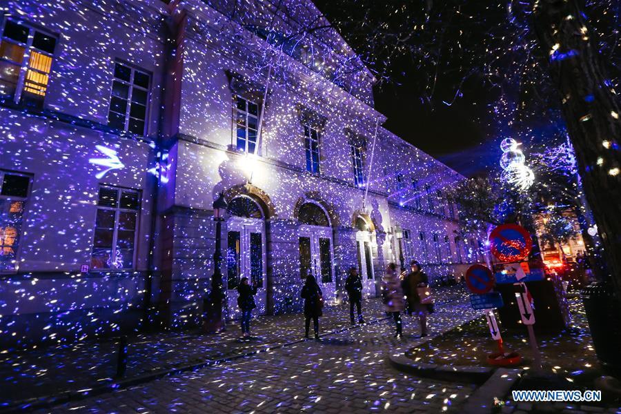 Visitors view an artistic light installation on the Bright Brussels Festival in Brussels, capital of Belgium, Feb. 14, 2019. Featuring a dozen of light installations, Bright Brussels Festival is held from Feb. 14 to Feb. 17, aiming to present the magic of light to the public. (Xinhua/Zhang Cheng)