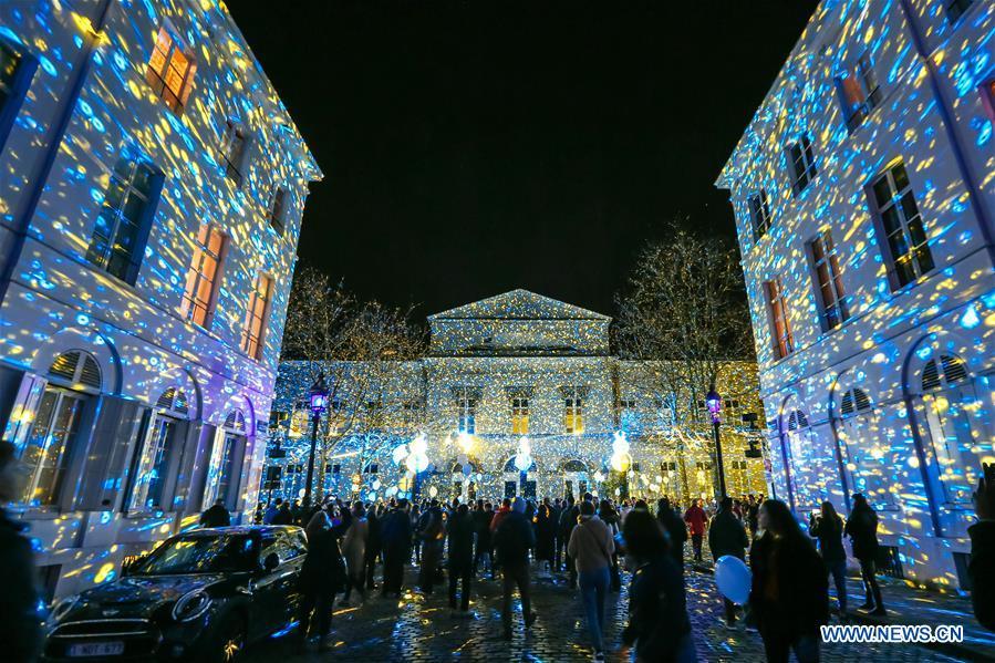 Visitors view an artistic light installation on the Bright Brussels Festival in Brussels, capital of Belgium, Feb. 14, 2019. Featuring a dozen of light installations, Bright Brussels Festival is held from Feb. 14 to Feb. 17, aiming to present the magic of light to the public. (Xinhua/Zhang Cheng)