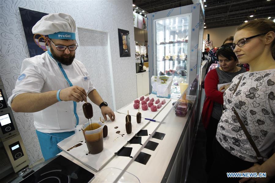 A confectionery cook makes popsicles at the Expo Sweet in Warsaw, Poland, on Feb. 17, 2019. Expo Sweet, one of the largest confectionery and ice-cream fairs in Poland, is held in Warsaw from Feb. 17 to 20. (Xinhua/Jaap Arriens)
