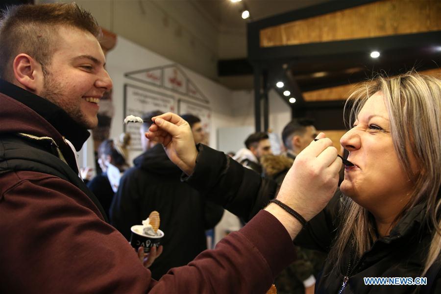 Visitors taste chocolate during the Chocolate Festival in Athens, Greece, Feb. 16, 2019. The four-day festival, held from February 14 to 17, involved tasting sessions, workshops and children activities led by experts dedicated to the art of chocolate. (Xinhua/Marios Lolos)