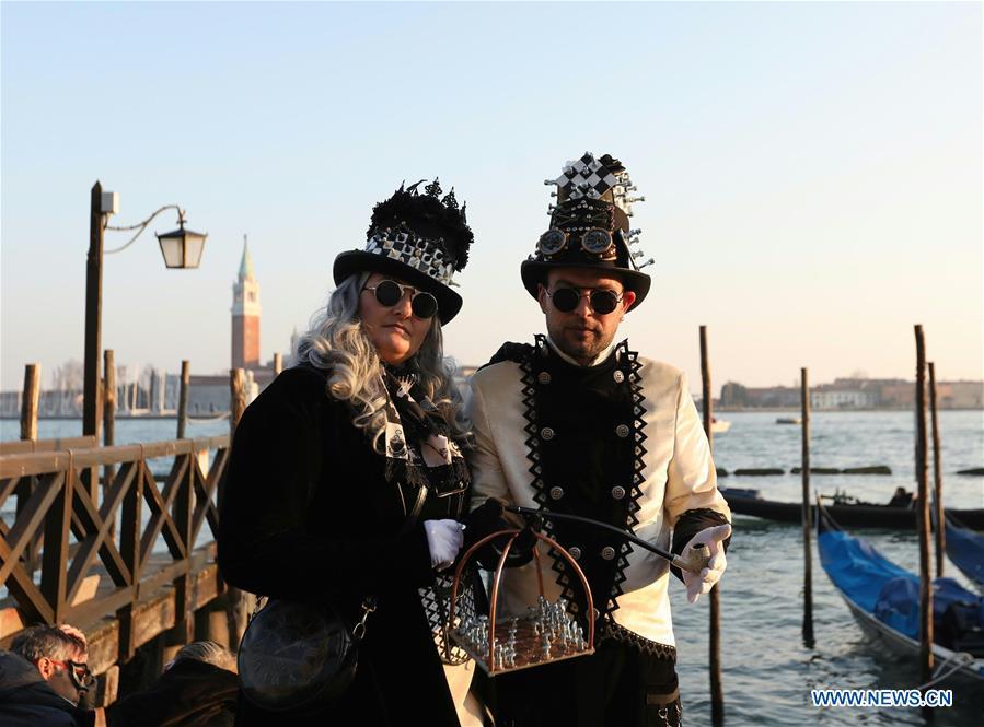 Revelers pose during the Venice Carnival in Venice, Italy, on Feb. 17, 2019. The Venice Carnival 2019 kicked off on Saturday and will last until March 5. (Xinhua/Cheng Tingting)