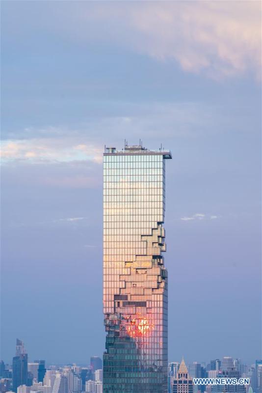 The photo shows King Power MahaNakhon skyscraper in sunset after rainfall in Bangkok, Thailand, Feb. 17, 2019. The rainfall helped to improve the air quality in Bangkok. (Xinhua/Zhang Keren)