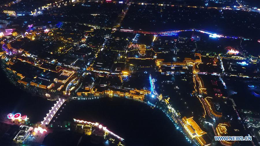 Aerial photo taken on Feb. 16, 2019 shows the night view of the ancient town of Taierzhuang in east China\'s Shandong Province. (Xinhua/Wang Kai)