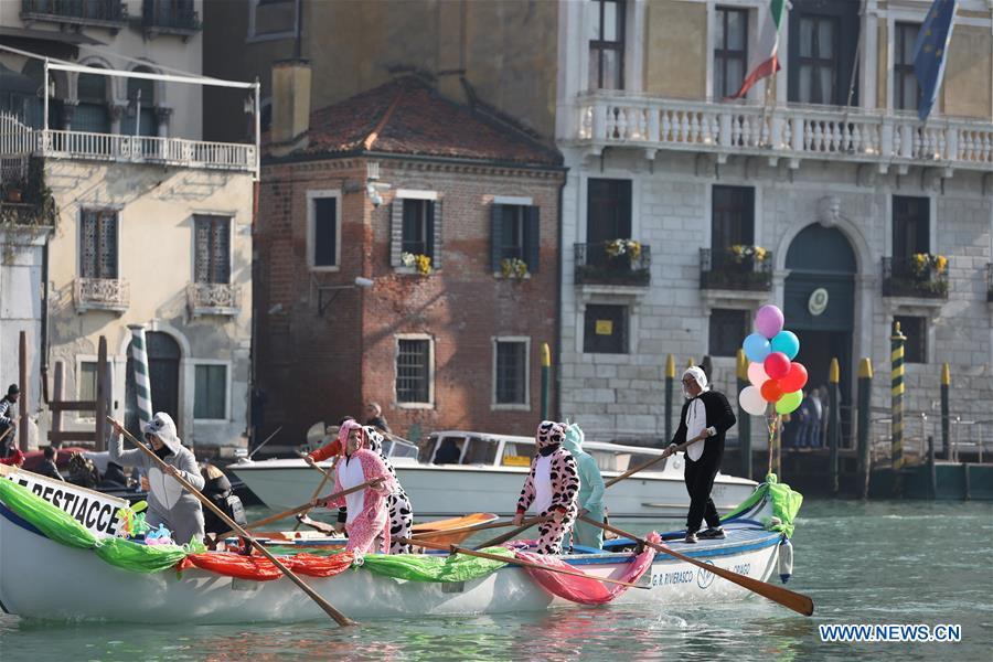 People participate in a water parade during the Venice Carnival in Venice, Italy, on Feb. 17, 2019. The Venice Carnival 2019 kicked off on Saturday and will last until March 5. (Xinhua/Cheng Tingting)