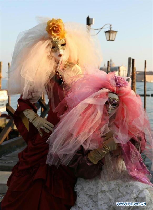Revelers pose during the Venice Carnival in Venice, Italy, on Feb. 17, 2019. The Venice Carnival 2019 kicked off on Saturday and will last until March 5. (Xinhua/Cheng Tingting)