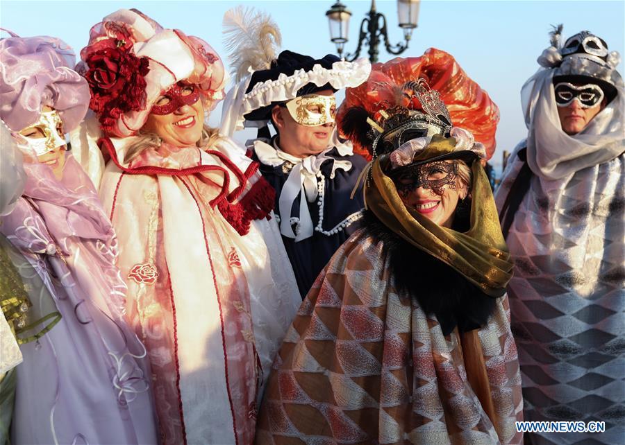 Revelers pose during the Venice Carnival in Venice, Italy, on Feb. 17, 2019. The Venice Carnival 2019 kicked off on Saturday and will last until March 5. (Xinhua/Cheng Tingting)